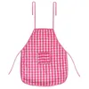 A pink and white checkered apron with a small pocket and straps, isolated on a white background. Náhled obrázku produktu