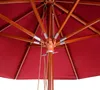 Close-up view of the interior structure of a red umbrella, showing the wooden ribs and central pole mechanism. Produktbild-Vorschau