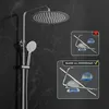 A shower system with a large round rain shower head and a handheld shower head, shown against a black marble-like background. Two inset images show the product components being weighed on a scale, with one indicating a lower weight (650g) and a red cross,  Produktbild-Vorschau