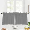 A kitchen window with gray cafe curtains and a sink faucet. Produktbild-Vorschau