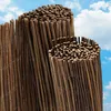Two rolls of woven reed fencing are shown against a blue sky with white clouds. Produktbild-Vorschau
