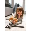 A young girl is lying on the floor with a stuffed animal. Náhled obrázku produktu
