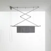 A ceiling-mounted clothes drying rack with towels hanging on it, shown in a clean, minimalist room. Podgląd zdjęcia produktu