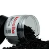 A clear plastic container of black dart tips is shown tipped over, spilling the contents onto a white surface. Anteprima dell’immagine prodotto