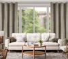 A living room scene with a sofa, coffee table, and curtains. Produktbild-Vorschau