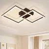 A modern black square LED ceiling light fixture mounted on a white ceiling. Voir les images du produit