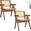 Two wooden chairs with cane webbing are shown against a white background, along with assembly tools. Produktbild-Vorschau