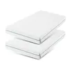 Two white mattresses stacked on top of each other. Produktbild-Vorschau