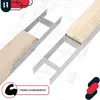 Two metal post anchors are shown supporting wooden beams, set against a blueprint background. Podgląd zdjęcia produktu