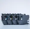 Four Brother LC3211 ink cartridges lined up on a white surface. Voir les images du produit