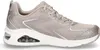 A side view of a single taupe and silver Skechers sneaker against a white background. Voir les images du produit