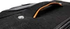 A close-up view of the handle and a button on a black suitcase. Produktbild-Vorschau