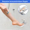 A person is shaving their leg in a shower, with a footrest and a small shelf for toiletries visible. Produktbild-Vorschau