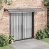 A door awning installed above a sliding glass door on a brick wall. Náhled obrázku produktu