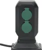 A black outdoor power outlet with two green covered sockets. Anteprima dell’immagine prodotto