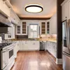 A modern kitchen with white cabinets, granite countertops, stainless steel appliances, and hardwood floors. Produktbild-Vorschau