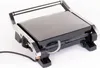 A close-up, studio shot of an electric grill on a white background. Produktbild-Vorschau