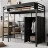 A loft bed with a desk and wardrobe, set up in a room with a concrete wall. Náhled obrázku produktu