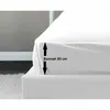 A close-up of a white fitted sheet on a bed, showing the depth of the sheet. Produktbild-Vorschau