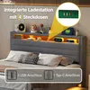 A bed with a headboard featuring integrated storage and lighting. Anteprima dell’immagine prodotto