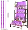 A plant shelf with plants under grow lights. Produktbild-Vorschau
