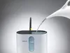 Water being poured into a humidifier. Produktbild-Vorschau