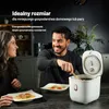 A couple happily eating from bowls in a kitchen setting, with a rice cooker in the foreground. Podgląd zdjęcia produktu