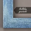 A close-up of a blue picture frame with a dark grey tag indicating the color and finish. Produktbild-Vorschau