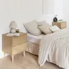 A bedroom scene with a bed and nightstands. Anteprima dell’immagine prodotto