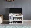 A shoe bench with storage in a hallway next to a basket. Produktbild-Vorschau