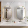 A modern bathroom vanity with two oval mirrors and sinks. Náhled obrázku produktu