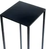 A close-up view of the top of a black, square metal plant stand or side table. Anteprima dell’immagine prodotto