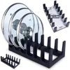 A set of black lid holders, with three glass pot lids in the foreground and a packaged set in the background. Produktbild-Vorschau