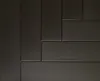 A close-up view of dark gray decorative foam panels arranged in a staggered pattern. Anteprima dell’immagine prodotto