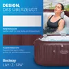 A woman relaxing in a brown inflatable hot tub, with marketing text and images describing its design features. Produktbild-Vorschau