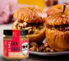 Baked apples filled with nuts and raisins, with a jar of Eierlikör in the foreground. Produktbild-Vorschau