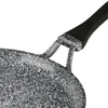 A close-up view of the handle and rim of a speckled frying pan. Voir les images du produit