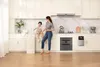 A woman and a child are in a modern kitchen. Voir les images du produit