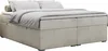 A low-profile boxspring bed without a headboard, dressed in neutral-toned bedding, is shown against a white background. Produktbild-Vorschau