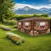 A wooden-style gazebo set up in a garden with flowers and mountains in the background. Voir les images du produit