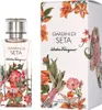 A perfume bottle and its box, both decorated with floral and bird illustrations. Produktbild-Vorschau