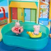 Peppa Pig characters playing in a toy water park with a pool, slide, and playhouse. Náhľad obrázku produktu
