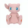 A plush toy of the Pokémon Mew sitting on a white background. Voir les images du produit