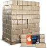 A pallet of compressed wood briquettes for heating, with a smaller package of briquettes in the foreground. Produktbild-Vorschau