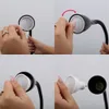 A collage of four images showing hands replacing a light bulb in a black lamp. Anteprima dell’immagine prodotto