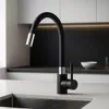 A modern kitchen sink with a black faucet. Náhľad obrázku produktu