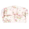 A miniature floral sofa with two cushions, shown from the front against a white background. Náhled obrázku produktu
