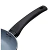 Close-up of a frying pan handle and part of the pan. Podgląd zdjęcia produktu