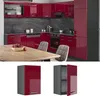 A modern kitchen with red high-gloss cabinets and a wooden table. Anteprima dell’immagine prodotto