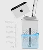 A humidifier being filled with water, with measurement markings on the side. Náhled obrázku produktu